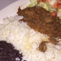 Ropa Vieja · Seasoned shredded beef or chicken cooked in a spinach red sauce, served with white rice, bla...