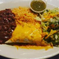 Mexican Combination With Chicken, Beef, And Seafood · A great assortment of Mexican food, including saffron, beans, lettuce, tomatoes, one enchila...