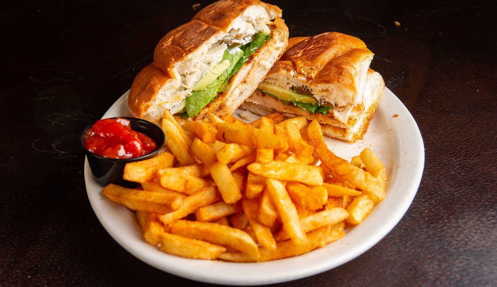 Torta · A Mexican bread roll with your choice of filling, lettuce, tomato, avocado, onions, and jalapeños. Served with French fries.