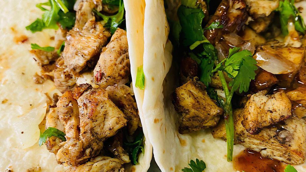 (3) Gully'S Chicken Street  Tacos  · 3 TACOS White meat marinated in jerk sauce serve w/cilantro, slice onion, topped with a sweet  jerk sauce. serve on a Flour tortilla taco size.