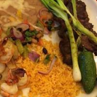Combo Azteca · Skirt steak butterflied and flame broiled to your liking. four prawns laced with garlic and ...