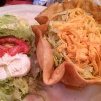 Deluxe Taco Salad · Guacamole and sour cream and your choice of chicken or beef.