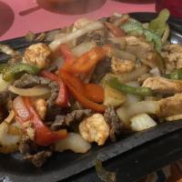 Fajitas Texanas · Chicken, beef, and shrimp.