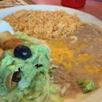 Chimichanga · Rolled, fried, and flour tortilla topped with lettuce, guacamole, and sour cream with choice...