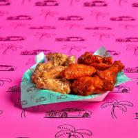15 Wings · 15 Classic Bone-in or Boneless wings with choice of 2 flavors and 2 dips.