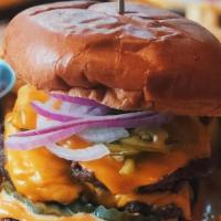 Adios Burger · brisket burger, American cheese, pickled jalapenos, sliced red onion, spicy garlic mayo. Ser...