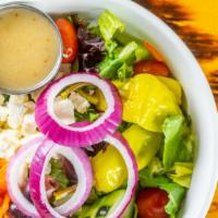 Greek Salad · Mixed greens, feta cheese, kalamata olives, cucumbers, cherry tomatoes, red onions, and pepp...