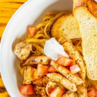Cajun Cream Chicken Pasta · Grilled or blackened chicken on top of a bed of fettuccine noodles, topped with diced tomato...