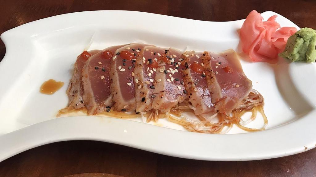 Sushi · 1 pc of tuna, salmon, white tuna, shrimp & crab stick over rice.
