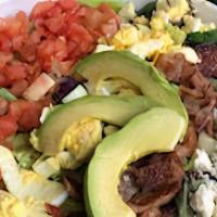 Cobb Salad With Grilled Chicken · Fresh spring mix with sliced grilled chicken crumbled feta cheese, hickory smoked bacon, har...