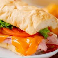 Holiday Hot Ham & Cheese · Our famous spiral sliced ham, cheddar cheese, lettuce, and tomato with our spicy honey musta...