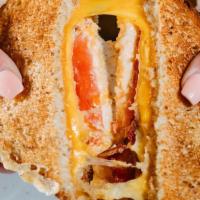 Grown Up Grilled Cheese · Papa's jalapeno pimento cheese, Swiss and gouda cheese, tomato, and honey glazed pepper baco...