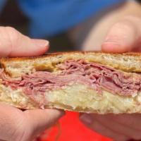 Reuben Infusion · Corned beef, Swiss cheese, spicy dijon, thousand Island, and sauerkraut on grilled rye.