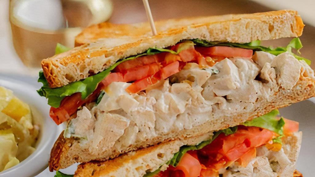 Chicken Salad · White-meat chicken, green onions, celery, almonds, blended with mayonnaise, fat-free yogurt and our special seasonings.