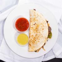 Fajita Quesadilla · Our grilled tortilla stuffed with cheese and your choice of marinated steak or chicken with ...