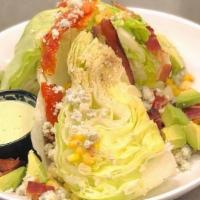 Wedge Salad · Iceberg lettuce, crispy bacon, crumbled blue cheese, roasted corn, avocado, roasted tomatoes...