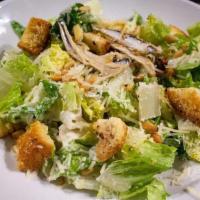 Caesar · Baby romaine, Caesar dressing, brioche croutons, Italian anchovies, Parmesan, and pine nuts