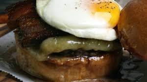 Bacon Breakfast Burger · Bacon Breakfast Burger with caramelized onions, aged white cheddar cheese, maple syrup aioli...