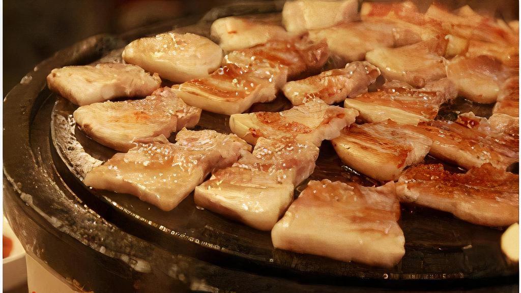 Sam Gyeop Sal|삼겹살 · Charcoal-grilled thick slices of pork belly meat served with lettuce. Comes with white rice