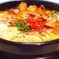 Seafood Suntofu|해물순두부 · Soft tofu, variety of seafood, and vegetables in spicy broth with egg. Comes with white rice.