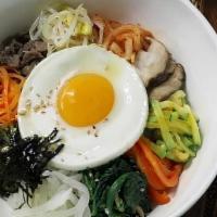 Bibimbap|비빔밥 · Assortment of lightly sautéed vegetables, fried egg, and choice of beef, spicy chicken, spic...