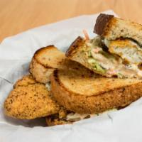 Fried Catfish · Hand breaded catfish, deep fried. Topped with our homemade slaw and cilantro dill aioli.