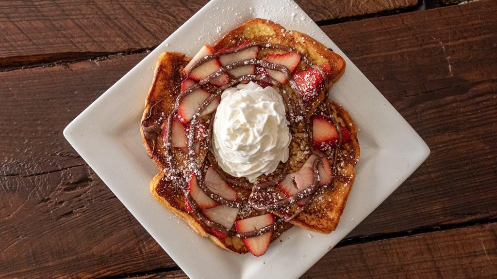 Strawberry Nutella · Strawberries, powdered sugar, and whip cream drizzled with Nutella.
