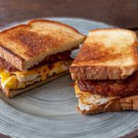 The Greatest · Two fried eggs, two hash brown patties, american cheese, and choice of protein piled high on...