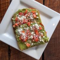 Avocado Toast · Avocado, tomato, goat cheese, and crushed red pepper flakes.  Served open face