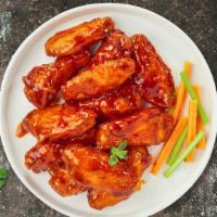 Mild Wings · Classic bone-in wings oven-baked, cooked to order perfectly crisp, tossed in our house made ...
