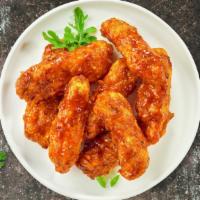 Kickin’ Bourbon Boneless Wings · Breaded boneless chicken breast chunks fried to perfection, tossed in our house made bourbon...