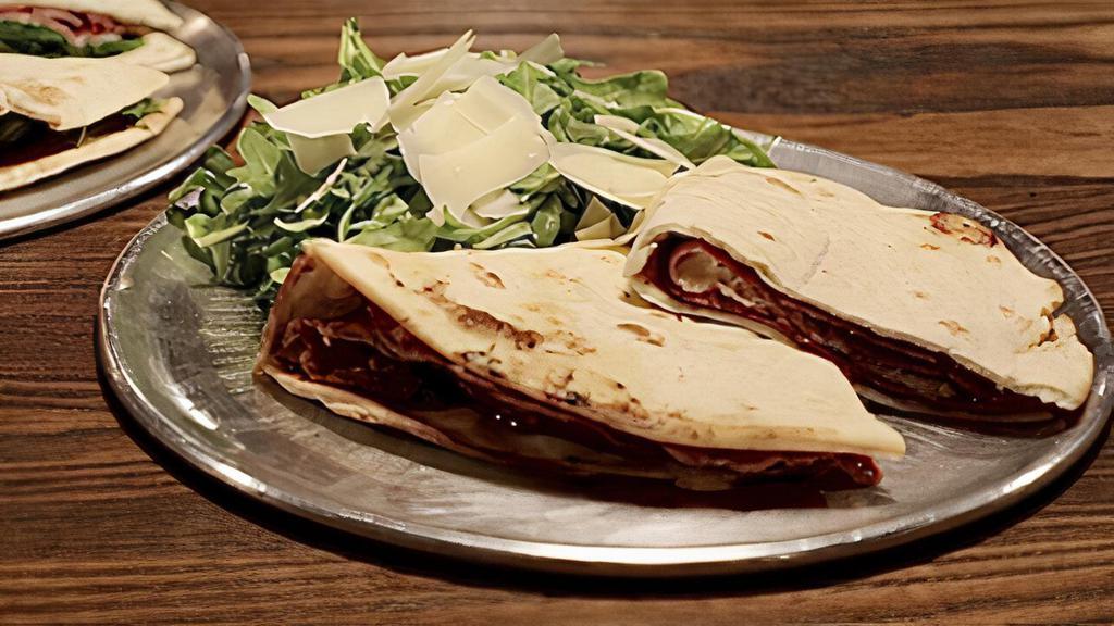The Aly · Soppressata, pecorino, strawberry preserves sandwich served with baby arugula and shaved parmesan dressed in extra virgin olive oil and lemon