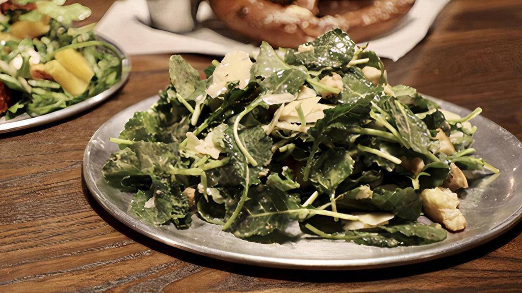 Baby Kale Caesar Salad · Tossed baby kale salad dressed with parmesan, lemon, olive oil toasted croutons, Caesar dressing.
