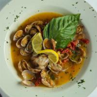 Clams Casino · Baby clams sautéed with sun dried tomatoes in a roasted garlic and white wine lemon butter s...