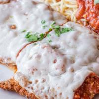 Pollo Parmigiana · Breaded chicken breast cutlets baked with tomato sauce and mozzarella cheese served with pas...