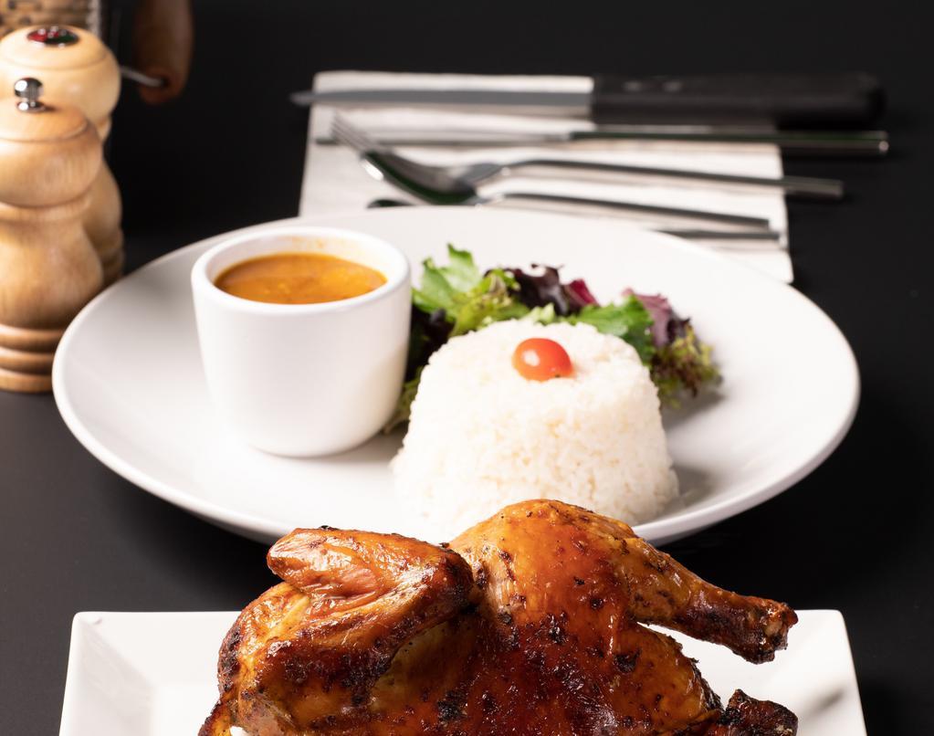 Pollo Al Horno / Baked Chicken.  1/2 · Half a chicken with your side of choice