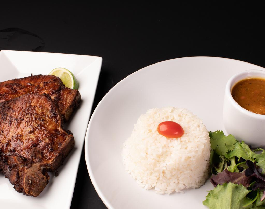 Chuleta / Fried Pork Chop.     · with your side of choice.