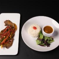 Bistec Salteado.   · Beef steak with onion and pepper (with your side choice ).