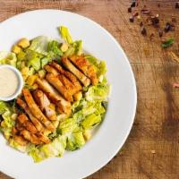 Classic Caesar Salad · Crisp romaine lettuce, parmesan cheese and crunchy croutons. Served with caesar dressing on ...