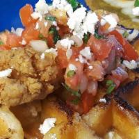 Chicken & Waffles · Double dipped breaded style chicken, smoky maple syrup, pico de gallo, queso fresco, waffle ...