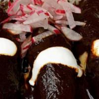 Mole Tia -Classic Enchliadas · Old Mexico scratch mole chicken adobado stuffed enchiladas flanked with your choice of side.