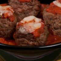 Oven-Baked Meatballs · Four large meatballs baked to perfection, topped with marinara sauce and freshly shredded Mo...