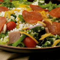 Hometown Pizza Salad · Fresh mix of iceberg, romaine and spinach topped with ham, pepperoni, green peppers, mushroo...