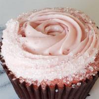 Cupcake, Strawberry Cream Cheese · Strawberry cake topped with strawberry cream cheese and sugar crystals.