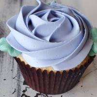 Cupcake, Lemon-Lavender · Our vanilla cake filled with lemon curd and finished with a rosette of lavender buttercream.