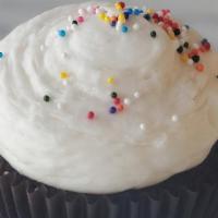 Cupcake, Chocolate Birthday · Chocolate fudge cake with vanilla buttercream and sprinkles.
