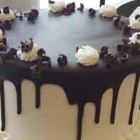 Tuxedo Signature Cake · 4 layers of Chocolate & Vanilla Cake, layered with Chocolate Ganache and Buttercream, finish...