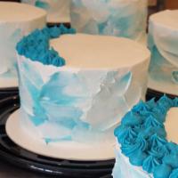 Vanilla Signature Cake · Four layers of vanilla cake filled with vanilla buttercream- finished with white sprinkles &...