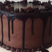 Chocolate Signature Cake · 4 layers of Chocolate Fudge Cake with Chocolate Buttercream and Ganache Drip