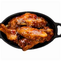 Bone -In Wings · Classic bone-in wings oven- baked, cooked to order perfectly crisp, tossed with your choice ...